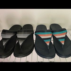 Crocs for sale size 7. Multicolored pair are blue and other pair is black